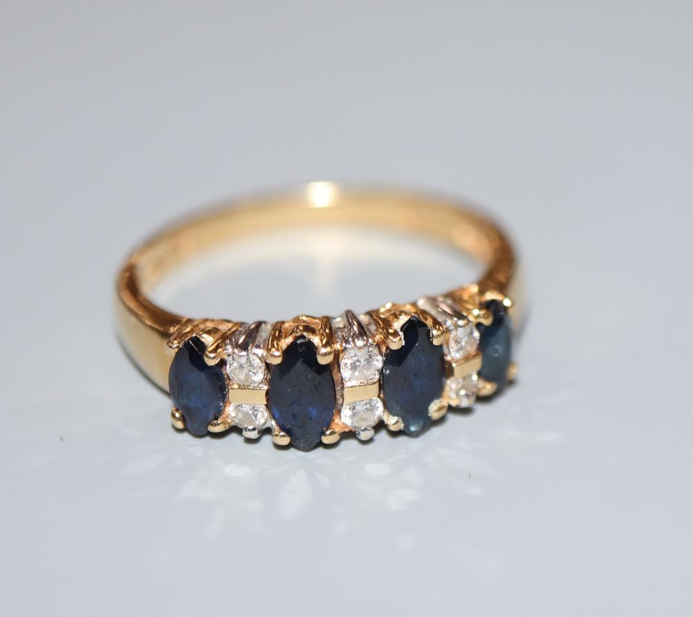 A modern 18ct gold, sapphire and diamond set half hoop ring, size L, gross 3.3 grams.